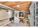 Finished basement with wood stove and decorative furniture and cabinets at 1669 S Uvalda St, Aurora, CO 80012