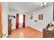 Bright bedroom with wood floors and window with red curtains at 1669 S Uvalda St, Aurora, CO 80012
