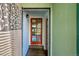 The inviting entryway features a wood-frame glass door and tile flooring at 1669 S Uvalda St, Aurora, CO 80012