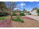Well-maintained home featuring a two-car garage and attractive yard with trees at 1669 S Uvalda St, Aurora, CO 80012