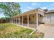 Back of the house with a covered patio at 335 N 11Th Ave, Brighton, CO 80601