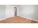 Neutral bedroom featuring hardwood floors and ample closet space at 335 N 11Th Ave, Brighton, CO 80601