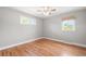 Serene bedroom showcasing hardwood floors and natural light at 335 N 11Th Ave, Brighton, CO 80601
