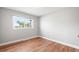 Bright bedroom featuring hardwood floors and a large window at 335 N 11Th Ave, Brighton, CO 80601