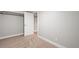 A basement bedroom with neutral carpeting and a doorway to another room at 335 N 11Th Ave, Brighton, CO 80601