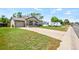 Charming home featuring stone accents, well-maintained lawn, and a driveway leading to a garage at 335 N 11Th Ave, Brighton, CO 80601