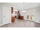 Bright kitchen featuring stainless appliances, wood cabinets, granite counters and french doors to back patio at 335 N 11Th Ave, Brighton, CO 80601