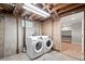 Modern, front load washer and dryer set in unfinished basement near doorway at 335 N 11Th Ave, Brighton, CO 80601