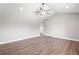 Spacious living room featuring vaulted ceilings, recessed lighting, and stylish wood-look flooring at 335 N 11Th Ave, Brighton, CO 80601