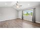 Bright living room featuring modern ceiling fan, recessed lighting, and stylish wood-look flooring at 335 N 11Th Ave, Brighton, CO 80601