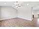 Spacious living room featuring vaulted ceilings, recessed lighting, and stylish wood-look flooring at 335 N 11Th Ave, Brighton, CO 80601