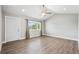 Bright living room featuring modern ceiling fan, recessed lighting, and stylish wood-look flooring at 335 N 11Th Ave, Brighton, CO 80601