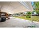 Covered patio with concrete floor and supporting posts at 335 N 11Th Ave, Brighton, CO 80601