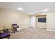 Finished basement with carpet, recessed lighting, media area, closet and chairs at 16177 E Prentice Pl, Centennial, CO 80015