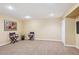 Finished basement with carpet, recessed lighting, and chairs; great for entertaining at 16177 E Prentice Pl, Centennial, CO 80015