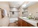 Bathroom featuring wood cabinets and a shower at 16177 E Prentice Pl, Centennial, CO 80015