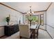 Elegant dining room with bay window, chandelier, and modern sideboard at 16177 E Prentice Pl, Centennial, CO 80015