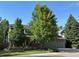 Well-maintained home featuring brick exterior, mature trees, landscaped yard, and a two car garage at 16177 E Prentice Pl, Centennial, CO 80015
