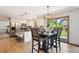 Modern kitchen featuring white cabinetry, stainless steel appliances, and a center island with stool seating at 16177 E Prentice Pl, Centennial, CO 80015