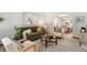 Comfortable living room with green sofa, white chairs, and dining area in the background at 16177 E Prentice Pl, Centennial, CO 80015