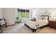 Bright main bedroom features a sitting area by the window and natural light at 16177 E Prentice Pl, Centennial, CO 80015