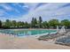 Community outdoor swimming pool with clearly marked lanes, ample deck space, and rows of lounge chairs at 16177 E Prentice Pl, Centennial, CO 80015