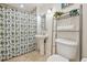 Clean bathroom with pedestal sink and shower/tub combo at 800 E 18Th Ave # 105, Denver, CO 80218