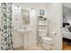 Clean bathroom with pedestal sink, toilet, and shower at 800 E 18Th Ave # 105, Denver, CO 80218