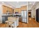 Modern kitchen with light wood cabinets and stainless steel appliances at 800 E 18Th Ave # 105, Denver, CO 80218