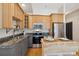 Modern kitchen with granite countertops and stainless steel appliances at 800 E 18Th Ave # 105, Denver, CO 80218