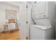 Stackable washer and dryer in a small laundry room at 800 E 18Th Ave # 105, Denver, CO 80218