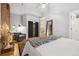 Main bedroom with exposed brick wall and ample closet space at 800 E 18Th Ave # 105, Denver, CO 80218