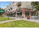 Modern brick building with shops on the ground floor at 800 E 18Th Ave # 105, Denver, CO 80218