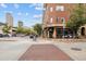 Urban street scene with shops and high rises at 800 E 18Th Ave # 105, Denver, CO 80218