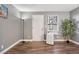 Spacious room with laminate flooring, a tall lamp, and large plant to create a modern feel at 63 S Sable Blvd # 16, Aurora, CO 80012