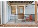 Cozy front porch featuring a small table and chairs, perfect for relaxing outdoors at 63 S Sable Blvd # 16, Aurora, CO 80012