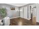 Bedroom with wood-look floors, large closet, and a portable AC unit at 63 S Sable Blvd # 16, Aurora, CO 80012