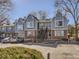 Two-story duplex with gray siding and brick at 63 S Sable Blvd # 16, Aurora, CO 80012