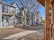 Gray townhouses with private balconies and a shared grassy area at 63 S Sable Blvd # 16, Aurora, CO 80012