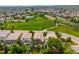 Features an aerial view of home, green space, neighborhood pool, and surrounding community at 14258 Greenfield Loop, Parker, CO 80134