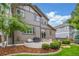 Spacious backyard featuring a patio, lush green lawn, mature trees, and neat landscaping at 14258 Greenfield Loop, Parker, CO 80134