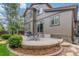Home's backyard features a patio with outdoor furniture and well-maintained landscaping at 14258 Greenfield Loop, Parker, CO 80134