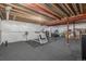 Spacious unfinished basement with open ceiling and carpeted floors, perfect for customization at 14258 Greenfield Loop, Parker, CO 80134