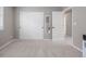 Neutral bedroom with sliding closet doors and an open doorway to the hall at 14258 Greenfield Loop, Parker, CO 80134