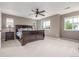 Bright bedroom with carpet and many windows showcasing the exterior at 14258 Greenfield Loop, Parker, CO 80134
