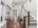 Elegant foyer with hardwood floors, a staircase, and an open view, creating a grand entrance at 14258 Greenfield Loop, Parker, CO 80134