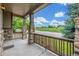 Inviting front porch with stone pillars and wood railing, offering a relaxing outdoor space and neighborhood views at 14258 Greenfield Loop, Parker, CO 80134