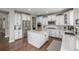 Modern kitchen with white cabinets, stainless steel appliances, and a center island, perfect for cooking at 14258 Greenfield Loop, Parker, CO 80134