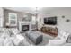 Cozy living room featuring a fireplace, soft lighting, and comfortable seating, creating a relaxing atmosphere at 14258 Greenfield Loop, Parker, CO 80134