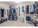 Spacious walk-in closet with ample hanging space and shelving for optimal organization at 14258 Greenfield Loop, Parker, CO 80134